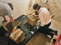 Conservator Sue Kelland and Heritage Centre Volunteer Dave Birch cleaning the stone. Conservator Sue Kelland and Heritage Centre Volunteer Dave Birch cleaning the stone.